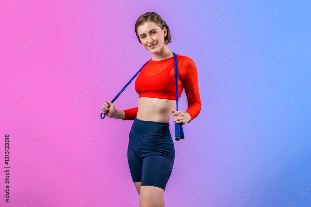 Full body length gaiety shot athletic and sporty young woman with fitness skipping rope in standing posture on isolated background. Healthy active and body care lifestyle. Full body length gaiety shot athletic and sporty young woman with fitness skipping rope in standing posture on isolated background. Healthy active and body care lifestyle.