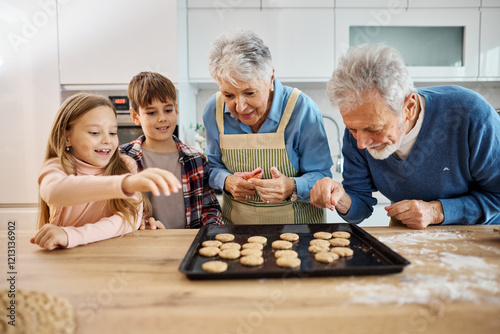 grandchild family child grandparent grandfather together grandmother cookie biscuit bake baking oven tasting eating dessert sweet holiday kitchen food
