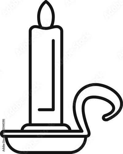 Candle burning on a candlestick with handle, creating a warm and inviting ambiance