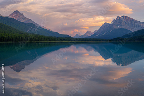 Sunset colours and reflections at the Waterfowl Upper Lake located just of Banff National Park’s Icefields Parkway.
 photo