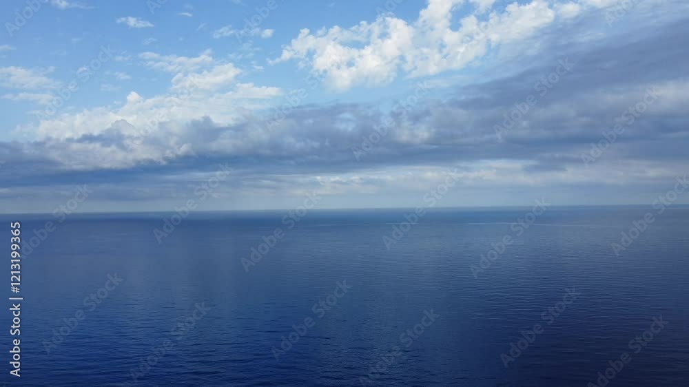 Aerial view of fantastic blue sea background. Mediterranean Sea, Montenegro, Europe. Beauty world, Blue horizon where the cloudless sky and the blue sea converge., view of Mediterranean sea in Algeria Aerial view of fantastic blue sea background. Mediterranean Sea, Montenegro, Europe. Beauty world, Blue horizon where the cloudless sky and the blue sea converge., view of Mediterranean sea in Algeria