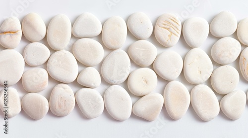 A closeup of smooth whitegray pebbles creates a serene stone texture, perfect for beachinspired designs. photo