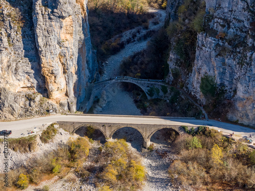 Old stone bridge of Noutsos (built 1750 AD), Epirus, Greece, Aerial drone view photo