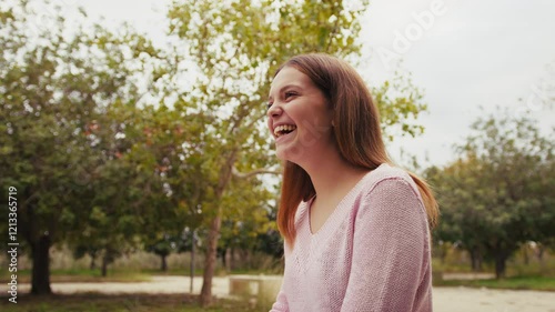 Girl Laughs Heartily At A Joke Of Her Friend In The Public Park