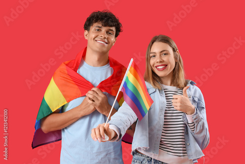 Young couple with LGBT flag...