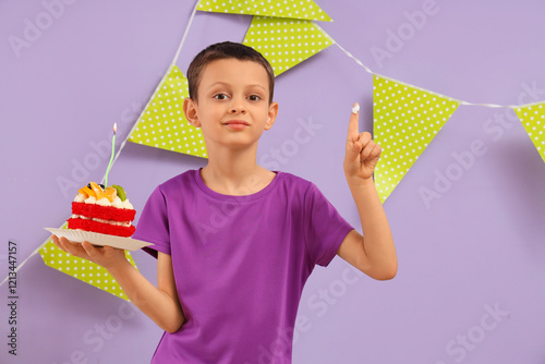 Cute little boy with Birthday cake and garland on purple background