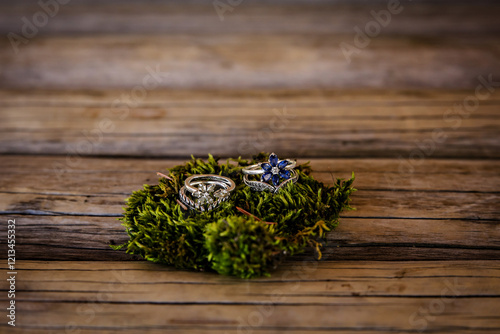Elegant silver wedding bands on a bed of moss