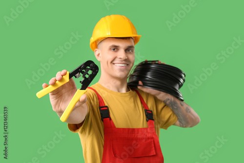 Young male electrician with...