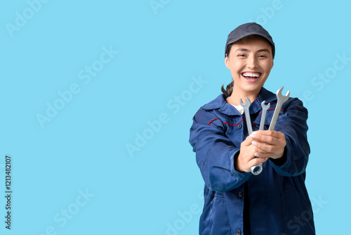 Young female mechanic with ...