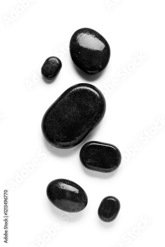 Composition with wet spa stones isolated on white background