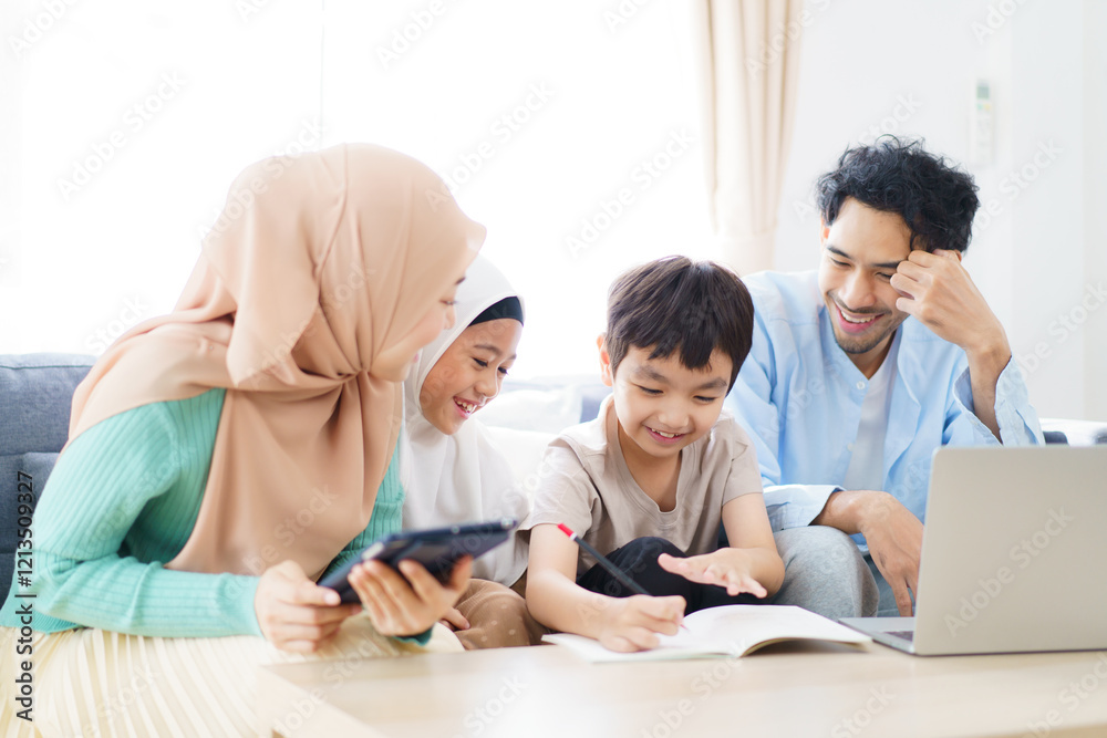 Asian muslim family relaxing in living room together.