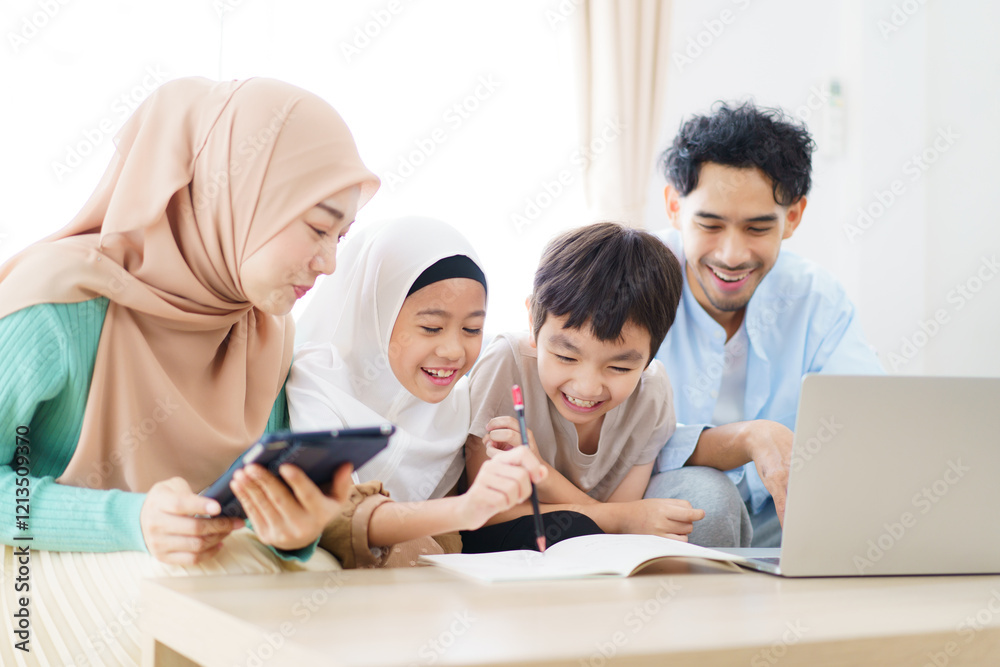 Asian muslim family relaxing in living room together. Asian muslim family relaxing in living room together.