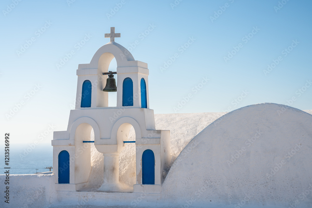 Typical bell tower of an orthodox church in Oia town, Santorini, Greece