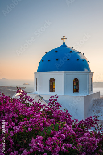 Iconic church and bouganvillea flowers, Santorini