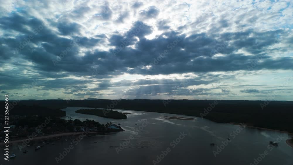 AERIAL: Dramatic clouds above the De Contas river and the Itacare town, in Brazil AERIAL: Dramatic clouds above the De Contas river and the Itacare town, in Brazil