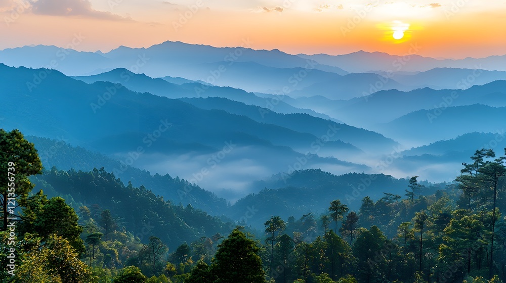 Fototapeta premium Majestic Sunrise Over Misty Mountain Peaks Symbolizing a New Day and Fresh Start Breathtaking landscape with layers of blue hues and a glowing sun breaking through the fog