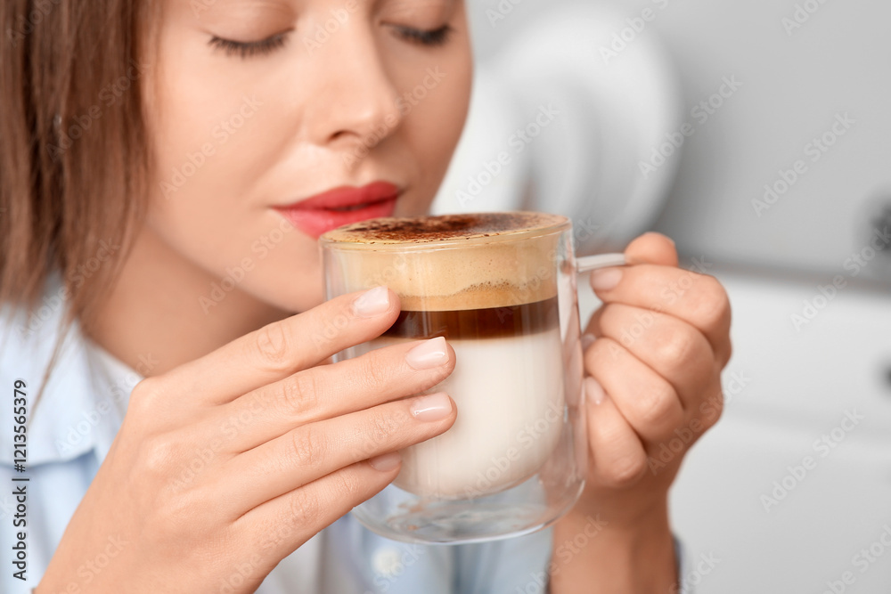 Beautiful young woman with glass cup of hot coffee in kitchen, closeup Beautiful young woman with glass cup of hot coffee in kitchen, closeup