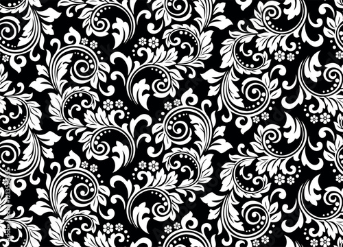 Wallpaper in the style of Baroque. Seamless vector background. White and black floral ornament. Graphic pattern for fabric, wallpaper, packaging. Ornate Damask flower ornament.