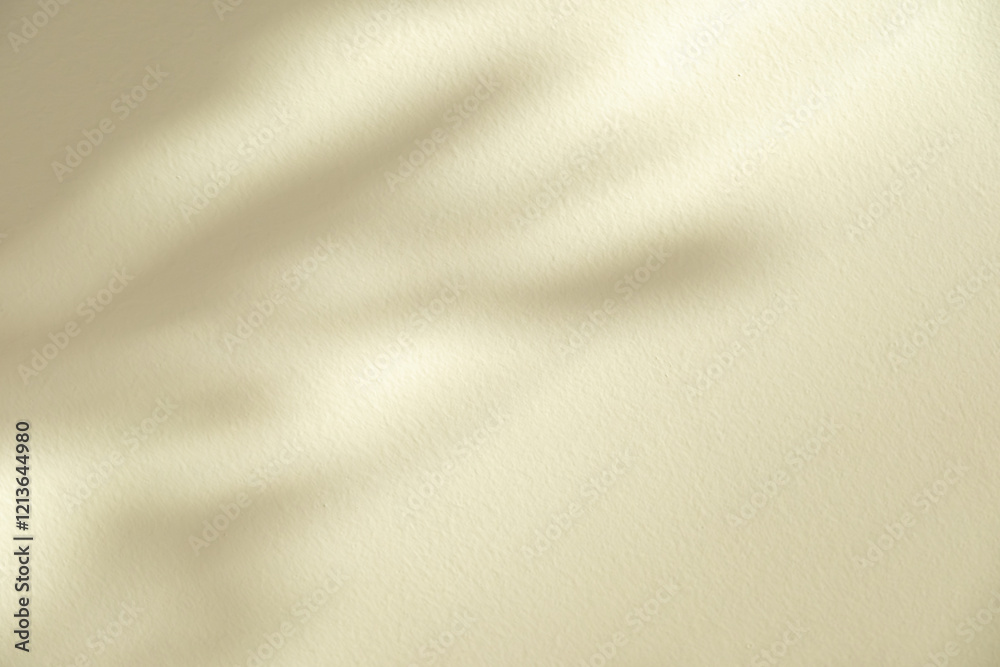 Fototapeta premium Wall interior background, studio and backdrops show products. with leaf shadow from window color beige and white. background for text insertion and presentation of product 