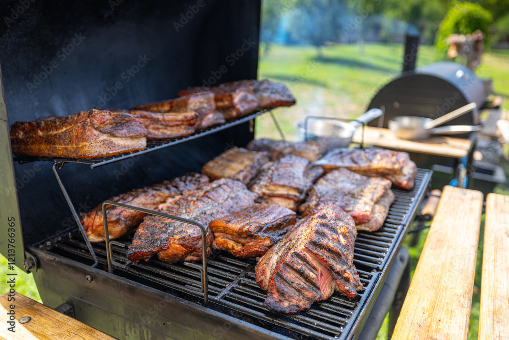 Close-up of meat smoking on a BBQ smoker outdoors, highlighting rich flavors and barbecue culture. Grilled pork meat and beef food. Outdoor cooking.