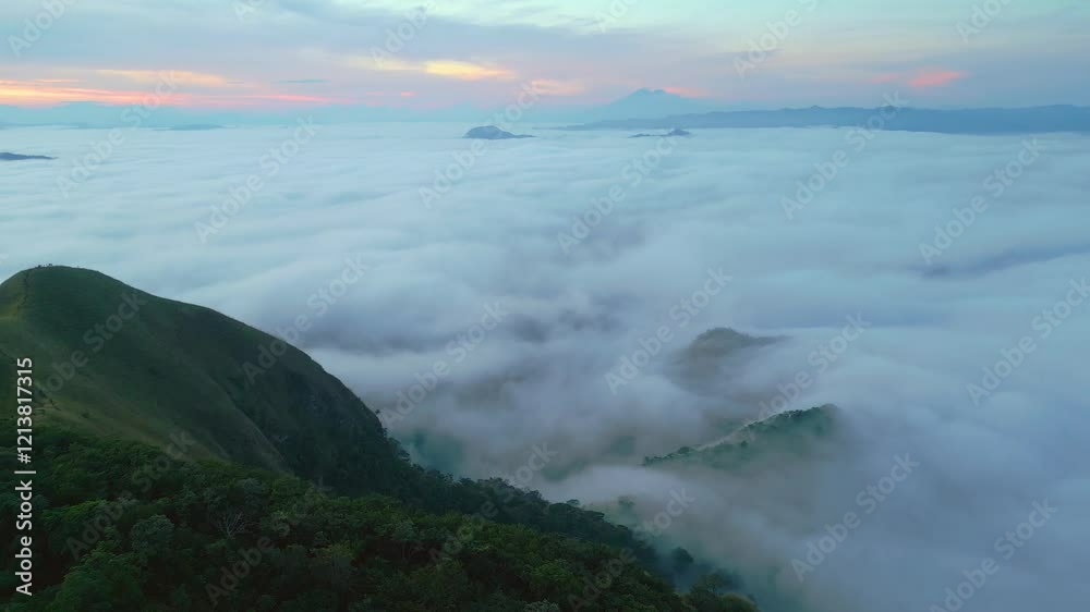 Eramon mountain peak at Chalatenango, El Salvador breathtaking sunrise surrounded by a sea of clouds, tranquil setting, drone view Eramon mountain peak at Chalatenango, El Salvador breathtaking sunrise surrounded by a sea of clouds, tranquil setting, drone view