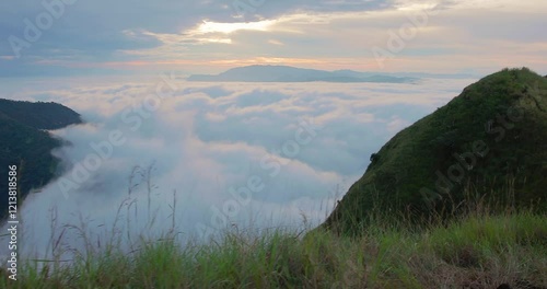 Eramon mountain at Chalatenango, El Salvador breathtaking sunrise above a sea of clouds, mountainous terrain. Tranquil atmosphere, nature's beauty at dawn - Camera movement right. photo