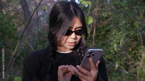 Depressed woman reacting to troubling news on her smartphone, with a distressed expression. Suitable for concepts of bankruptcy, disease, or personal issues, highlighting anxiety and unhappiness