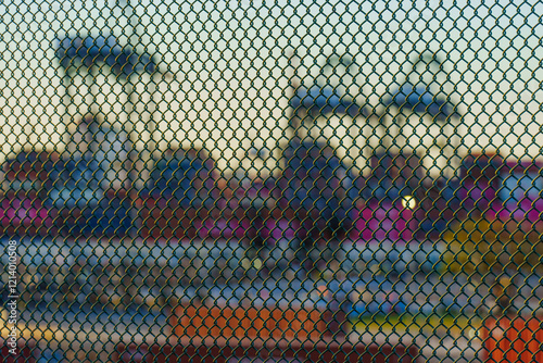 Blurry View Through Mesh of Cranes at Long Beach Port, CA photo