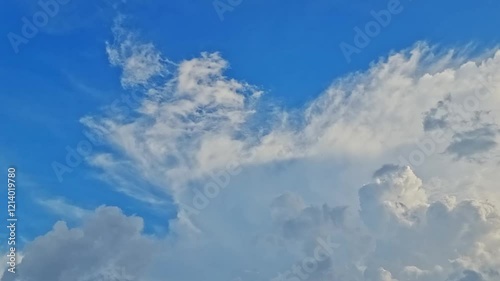 abstract timelapse of clouds in the sky, capturing the natural movement of white and gray clouds