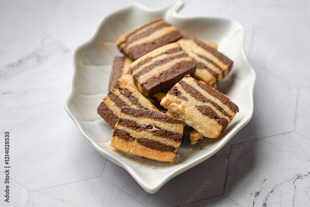 A plate of Striped Butter Cookies atau Biskut Belang. A plate of Striped Butter Cookies atau Biskut Belang.