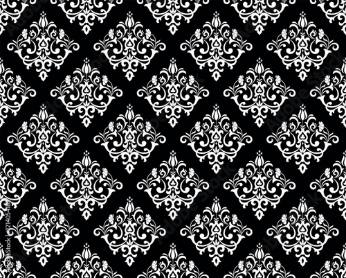 Wallpaper in the style of Baroque. Seamless vector background. White and black floral ornament. Graphic pattern for fabric, wallpaper, packaging. Ornate Damask flower ornament.
