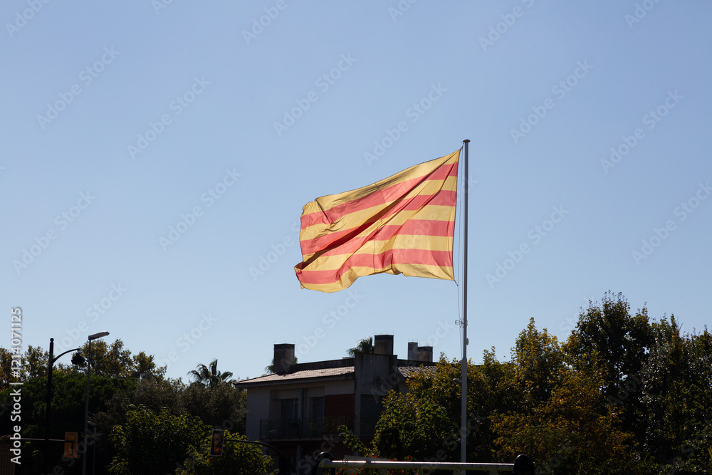 Catalan flag waving on a sunny day with blue sky