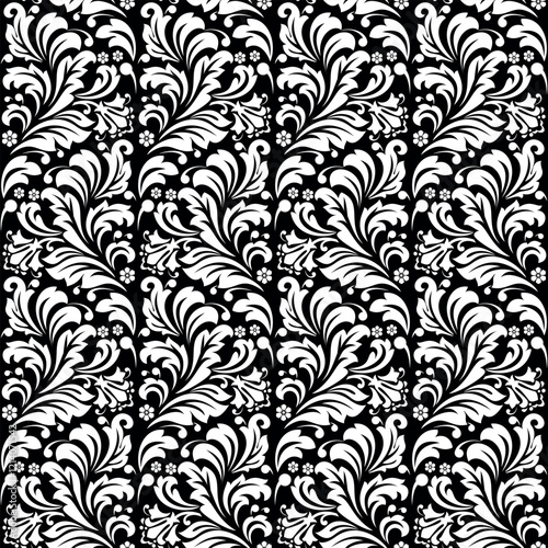 Wallpaper in the style of Baroque. Seamless vector background. White and black floral ornament. Graphic pattern for fabric, wallpaper, packaging. Ornate Damask flower ornament.