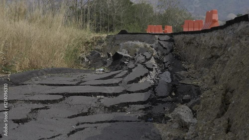 A video of a damaged road after an earthquake in a village area