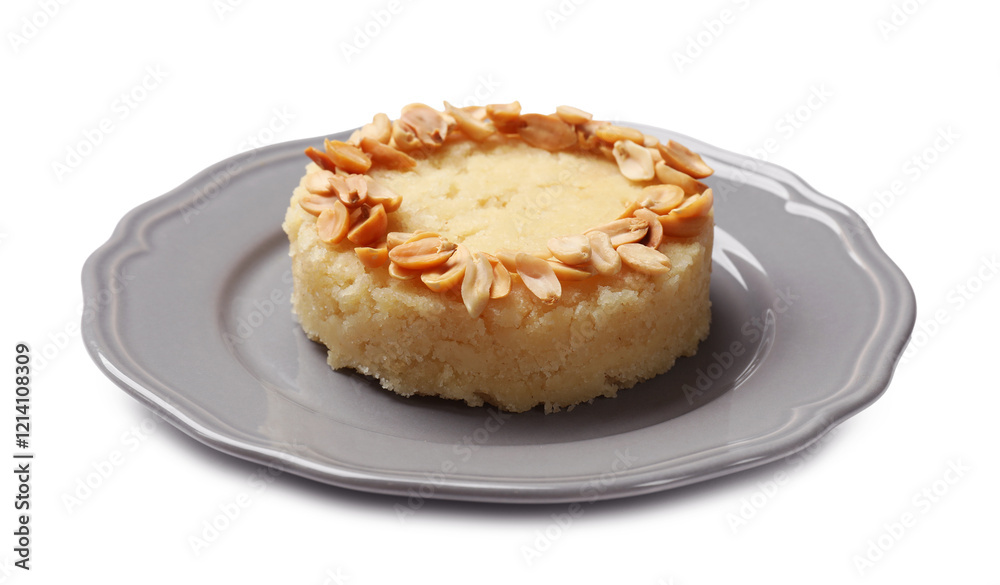 Delicious semolina halva with almond flakes isolated on white Delicious semolina halva with almond flakes isolated on white