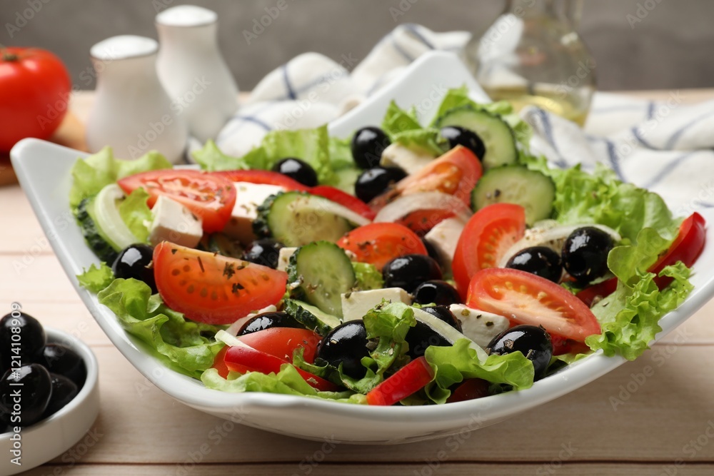 Delicious fresh Greek salad on white wooden table, closeup Delicious fresh Greek salad on white wooden table, closeup