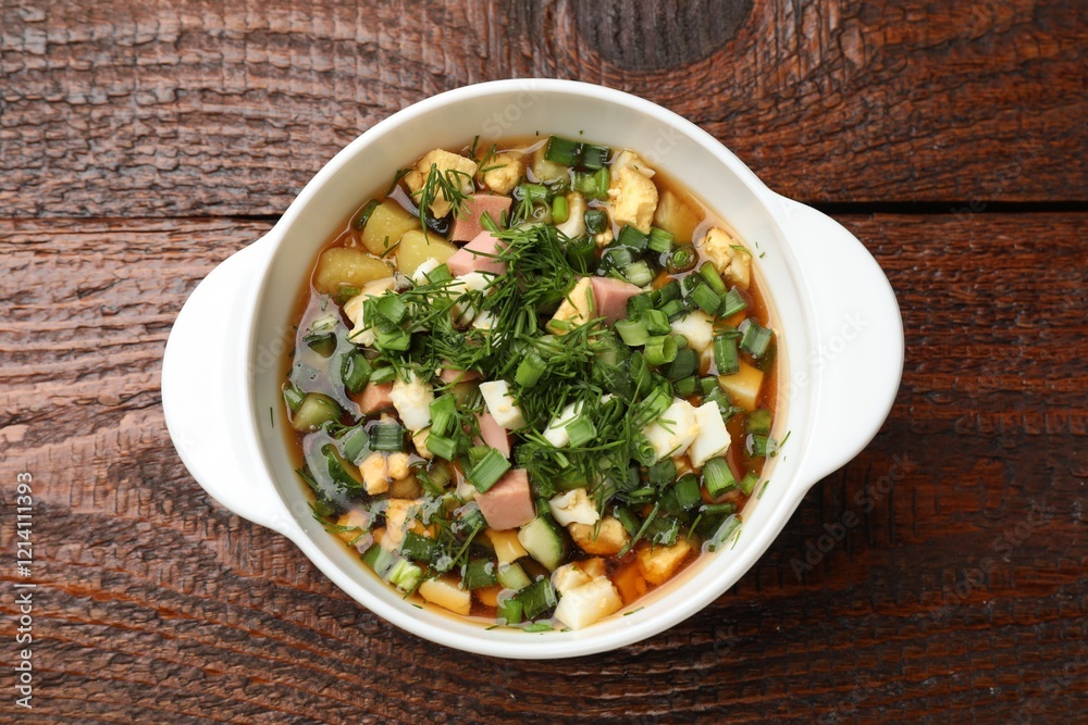 Delicious okroshka soup on wooden table, top view Delicious okroshka soup on wooden table, top view