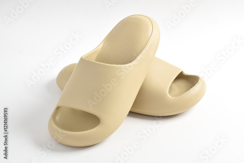 A pair of rubber slippers isolated on white background. Soft slippers photo