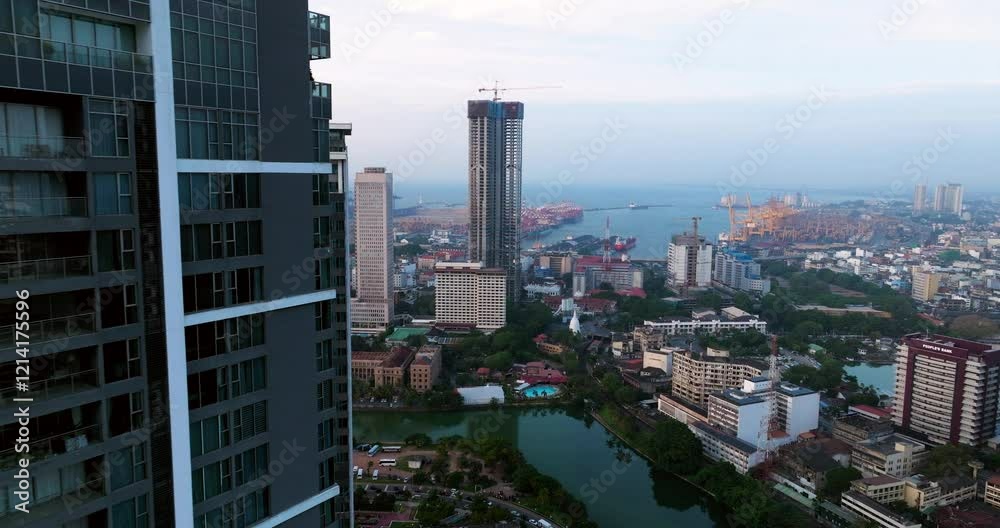 City Sights With Towers And High Rise Buildings In Colombo, Sri Lanka At Sunset. Aerial Drone Shot City Sights With Towers And High Rise Buildings In Colombo, Sri Lanka At Sunset. Aerial Drone Shot