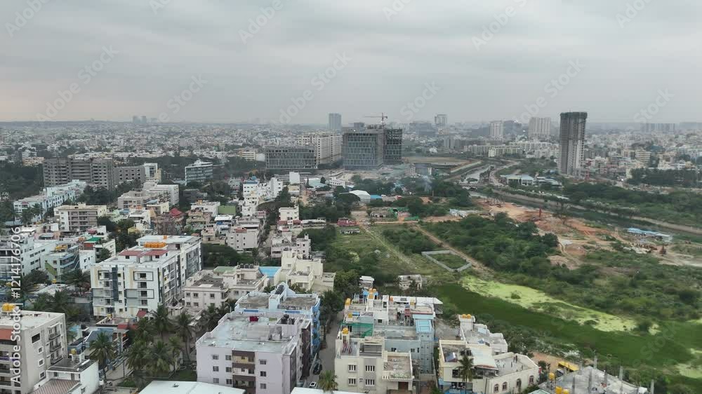 Aerial view of Bangalore city showcasing residential buildings under a cloudy sky