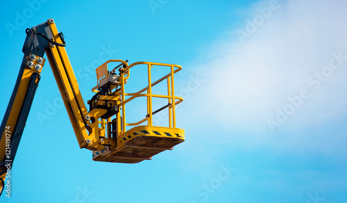 Wallpaper Mural Elevated mobile platform cherrypicker used for construction work under a clear blue sky Torontodigital.ca