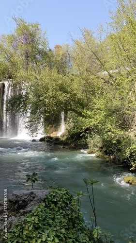A majestic waterfall in full fall, with the water flowing