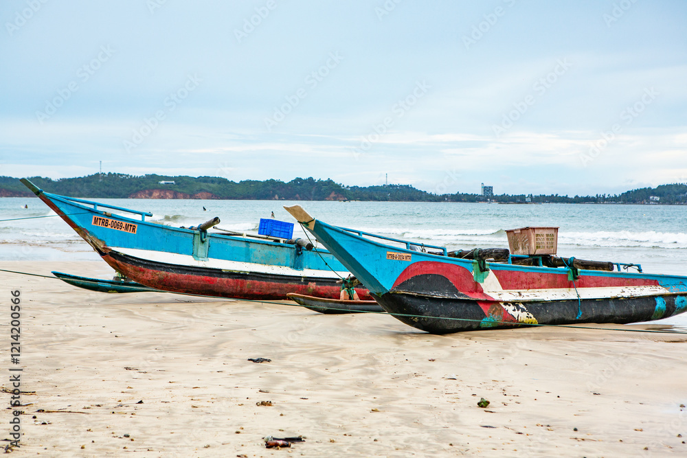 Traditional colorful boats in sri lanka on the coast of the indian ocean. Traditional colorful boats in sri lanka on the coast of the indian ocean.