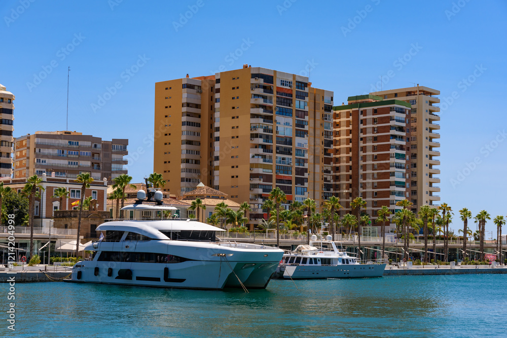 Malaga, Spain - August 06, 2024: Palmeral de las Sorpresas promenade in seaport. Malaga, Andalusia