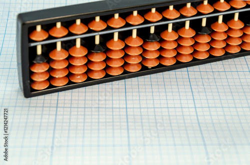 Abacus for mental arithmetic on light blue checkered background. space for text