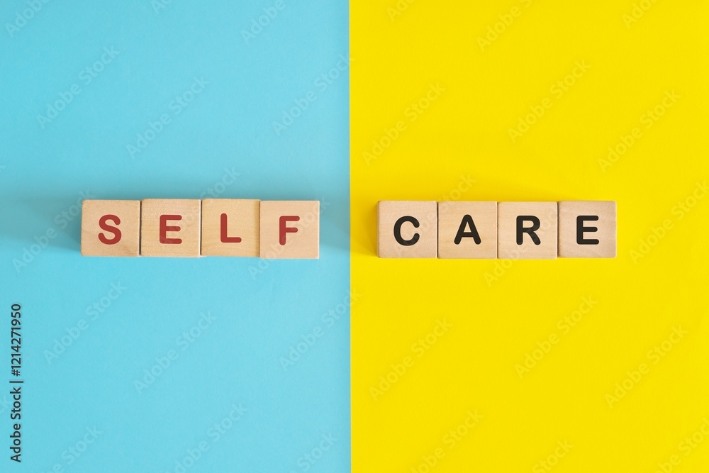 Self care reminder and awareness wooden blocks typography in bright blue and yellow background.