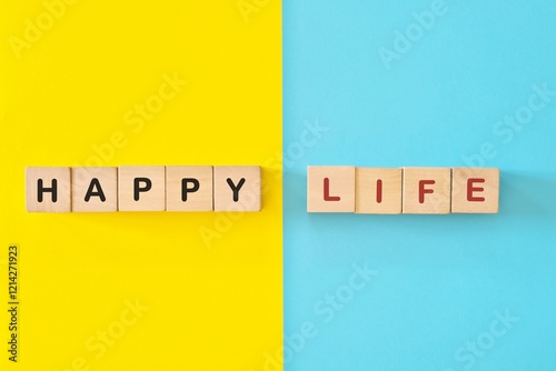 Obraz na płótnie Happy life reminder wooden blocks typography in bright blue and yellow background. w salonie