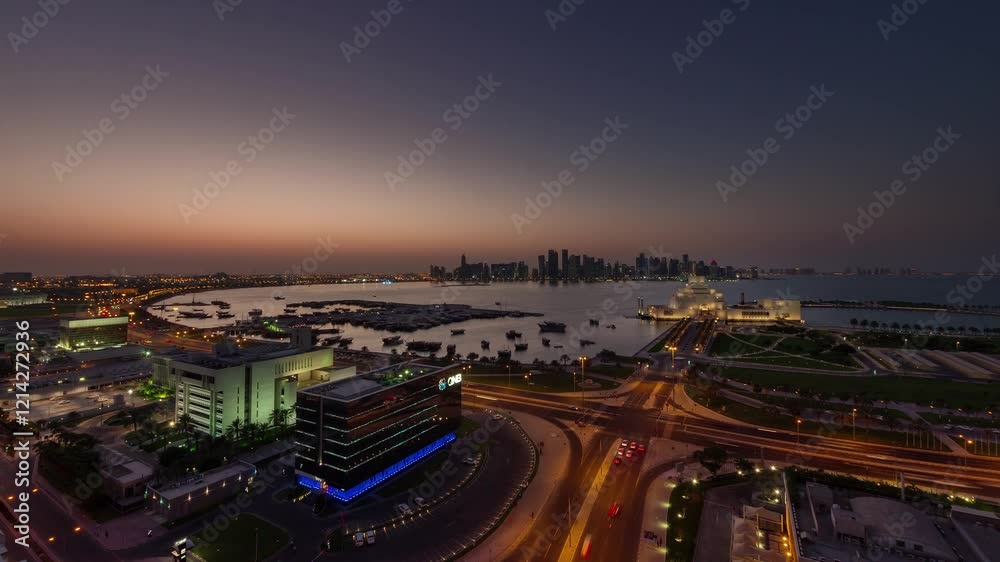 DOHA, QATAR - JANUARY 20, 2025: Night view of vibrant city skyline with illuminated buildings and waterfront activity DOHA, QATAR - JANUARY 20, 2025: Night view of vibrant city skyline with illuminated buildings and waterfront activity