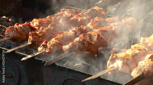 shish kebab on skewers is grilled on a sunny day