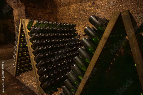 Riddling manual process in caves, traditional method of production of cremant sparkling wine in south part of Luxembourg country on bank of Moezel, Mosel river. photo